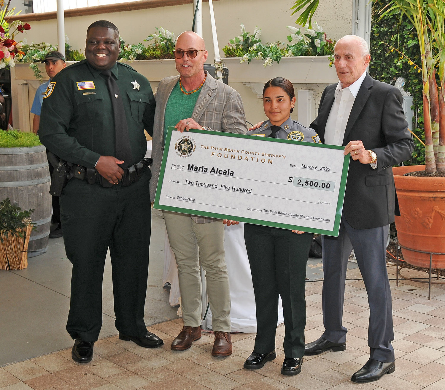 PBSO Deputy Johnny Young, Sheriff’s Foundation Director Lance Ivey, Maria Alcala from Glades Day School and PBSO Chief Deputy Frank DeMario.